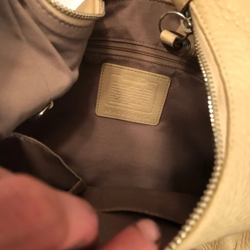 Coach cream pebbled leather perforated hobo bag